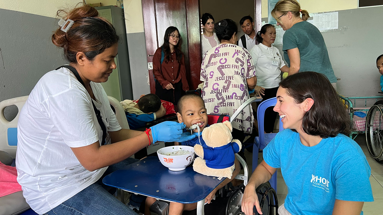 Feeding a child in an orphanage in Cambodia