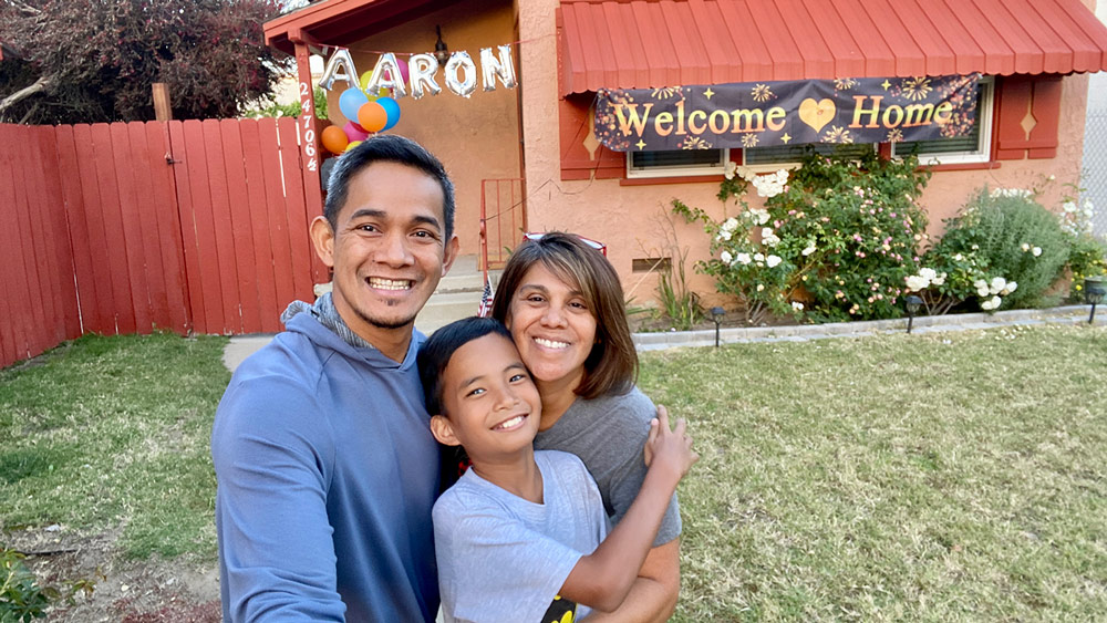 Adoptive family with older boy adopted from the Philippines