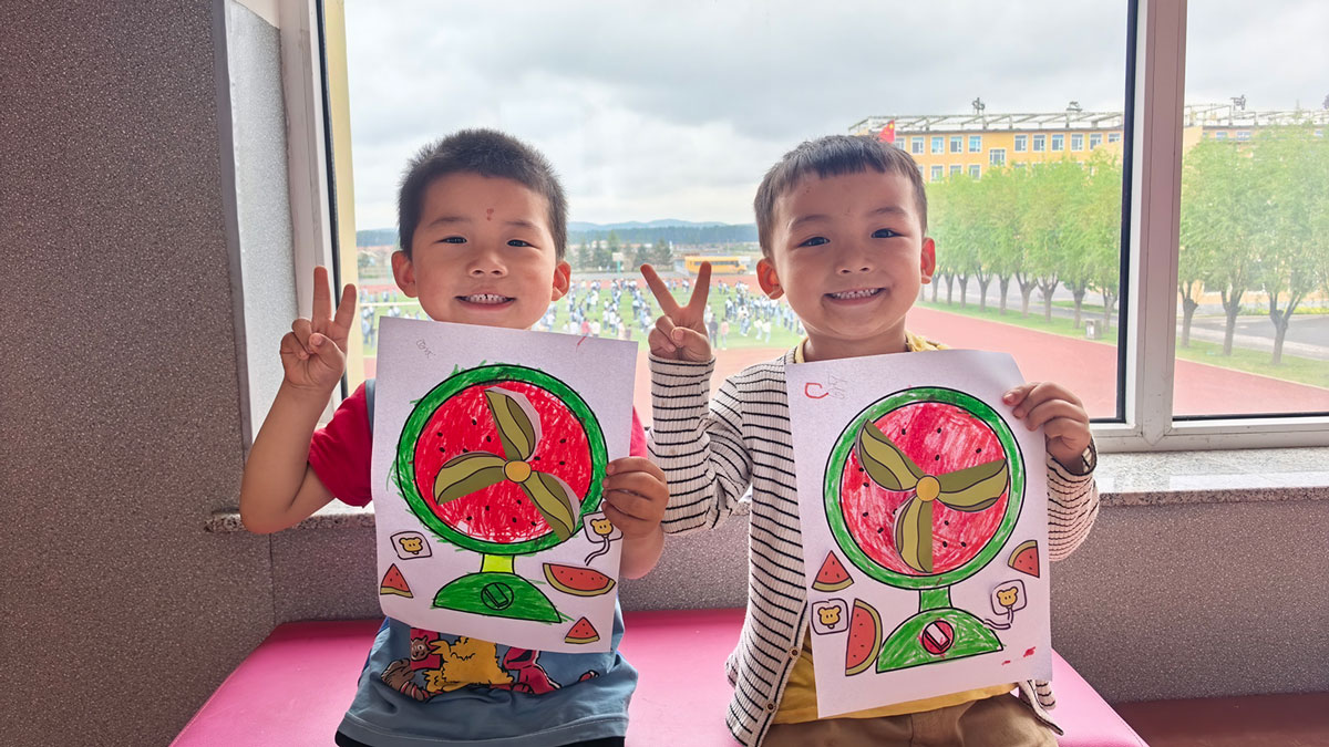 Brothers in Holt's family strengthening program in China smile and hold up peace sign