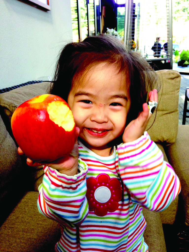Charlotte after her heart surgery -- full of life and a healthy appetite! 