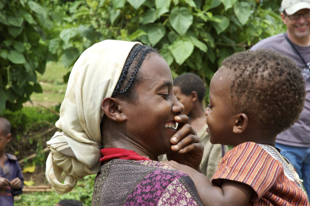 A mother sharing a special moment with her child.