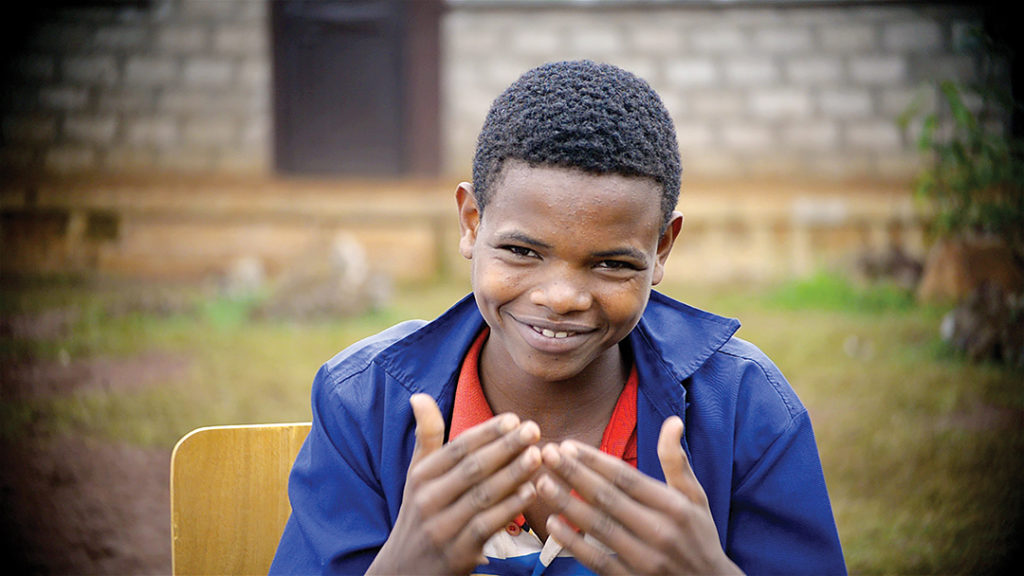 Dawit signs “thank you and God bless you” to his sponsors in the U.S.