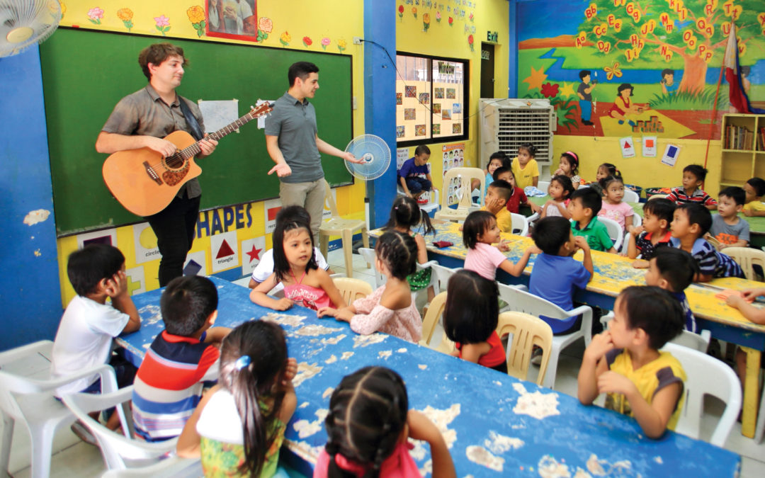 David singing to a classroom of preschoolers.