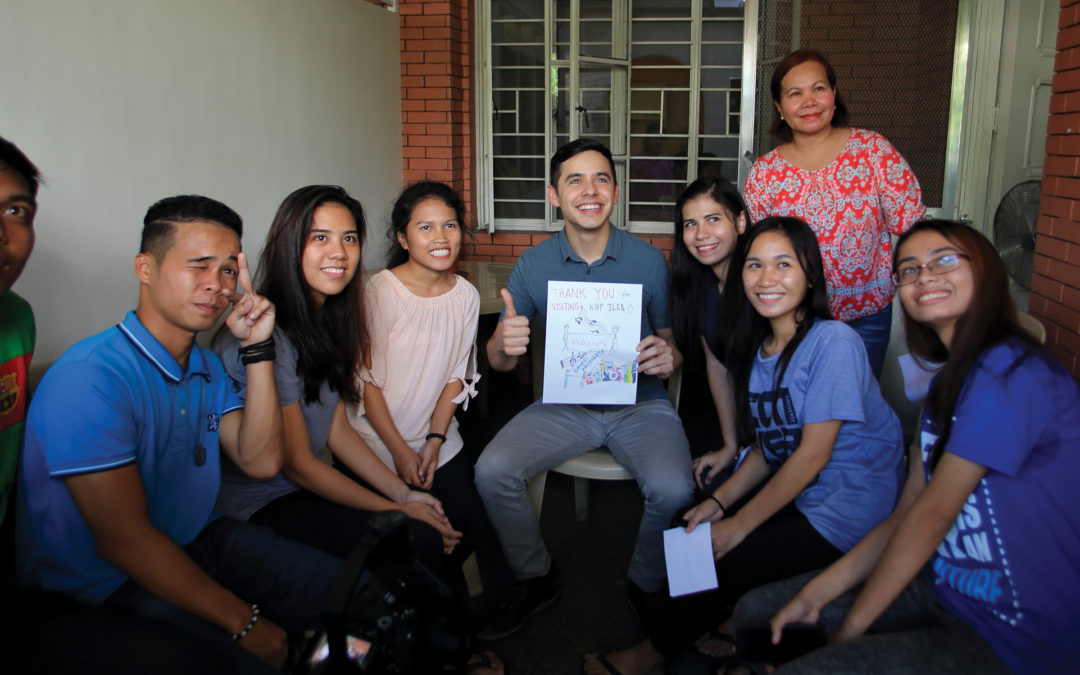 David with teens and young adults who are pursuing college with help from their Holt sponsors.