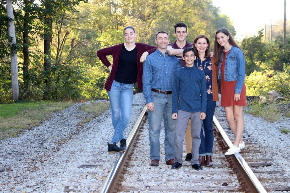 Anton (center) surrounded by his family. 
