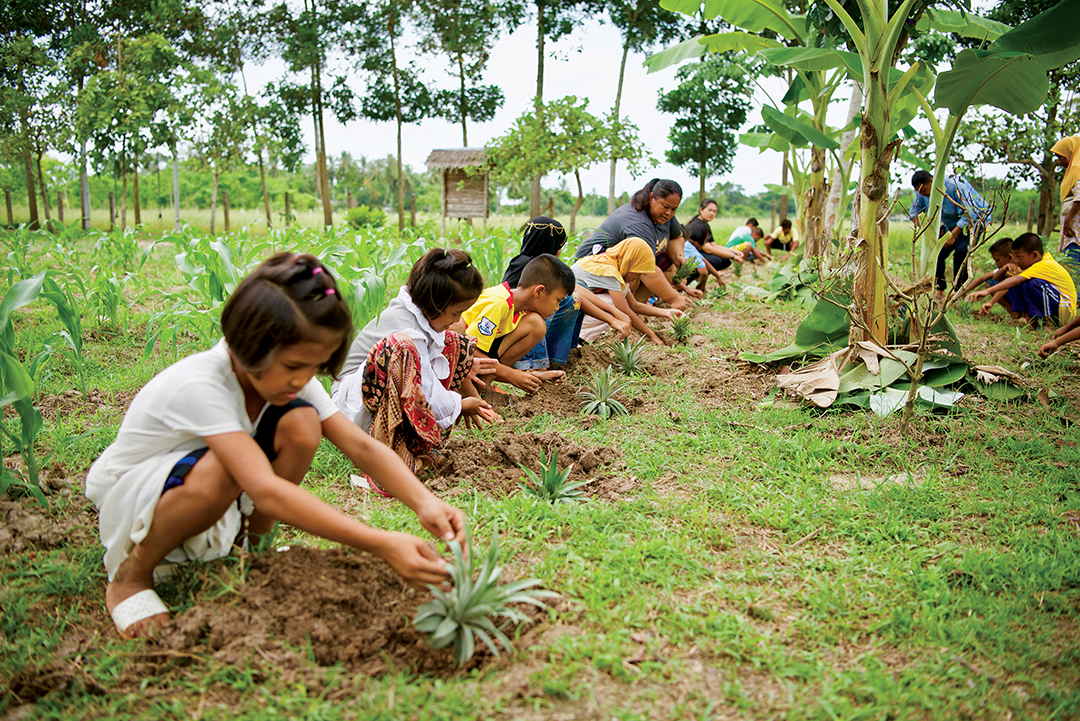 children plant a garden, from Gifts of Hope