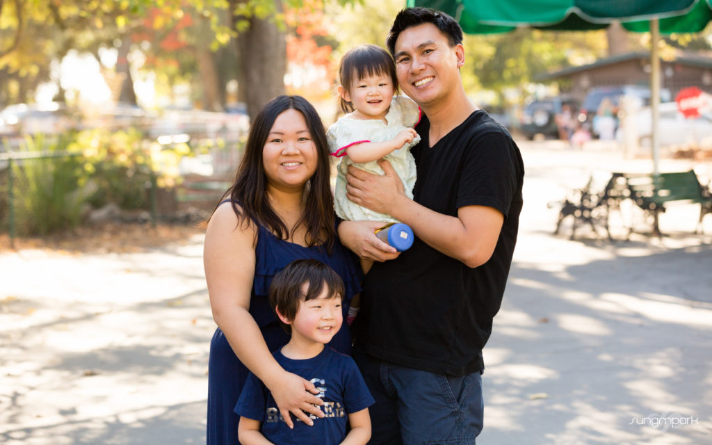 portrait of mom dad son and daughter smiling