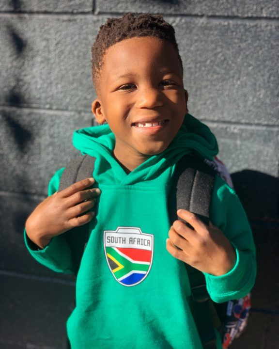 The Turners' adopted son in a South Africa sweatshirt.