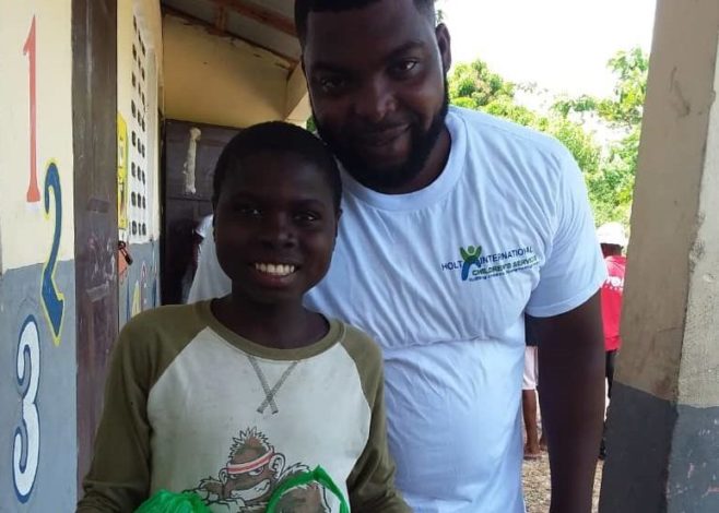 Two Haitian people smiling 