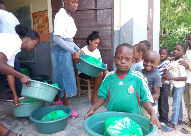 People carrying supplies in Haiti