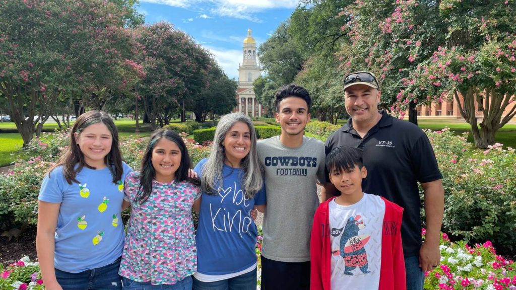 family smiles with adopted son from Vietnam