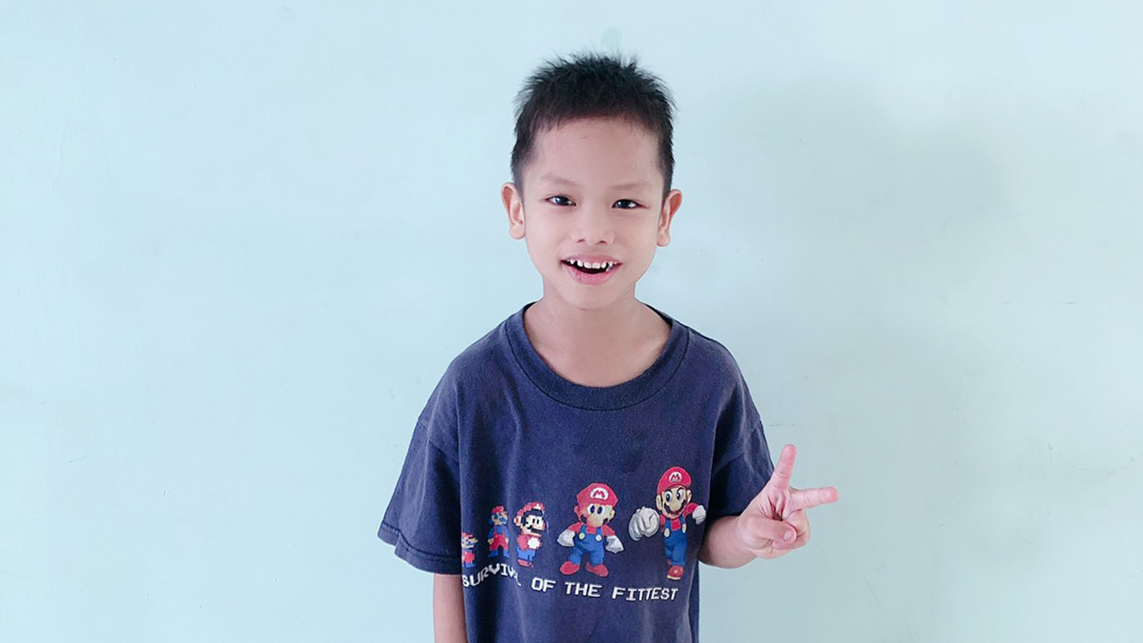 cam needs an adoptive family making peace sign