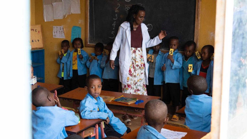 A teacher and students at an early childhood development center in Ethiopia.