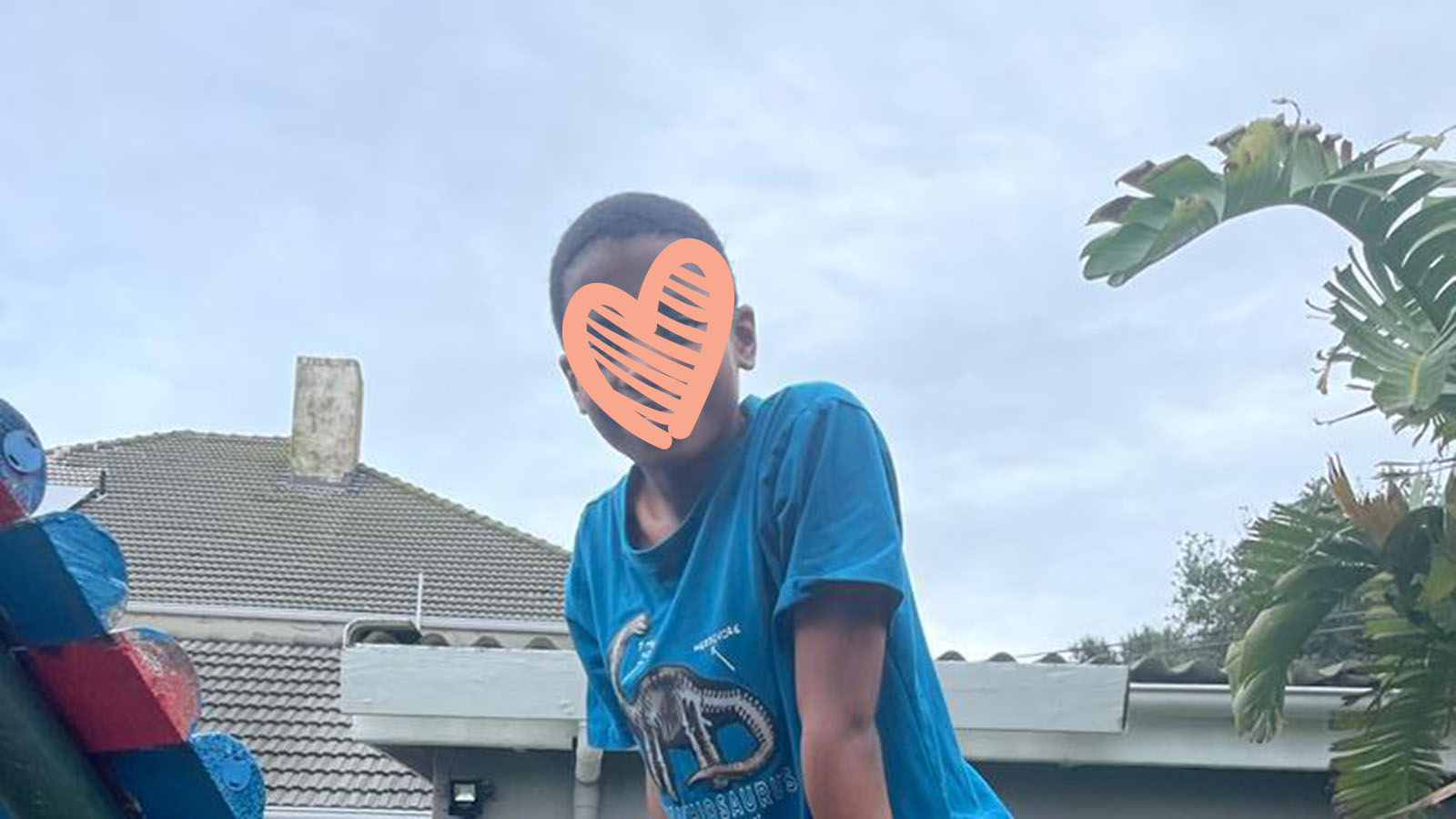 Boy in blue shirt playing