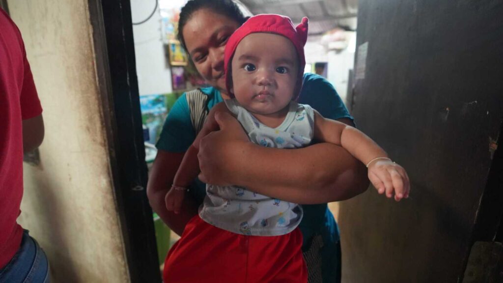 A boy in kinship care with his aunt who are Burmese migrants in Thailand