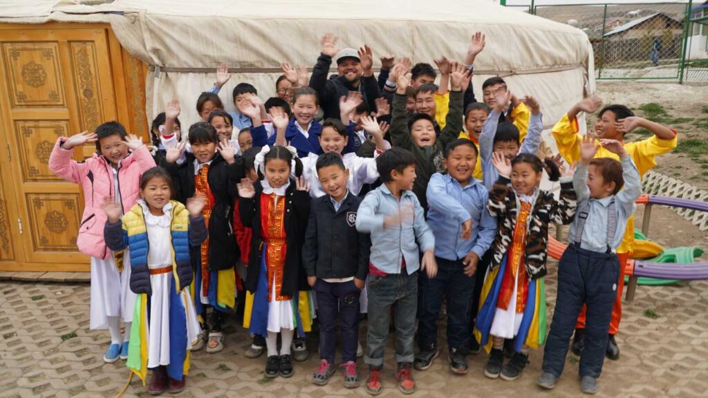 Holt International Mongolia Heritage Tour participants in front of a ger home