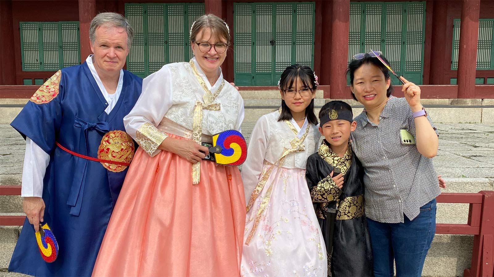 Adoptive family with two children adopted from Korea, all dressed in traditional Korean dress