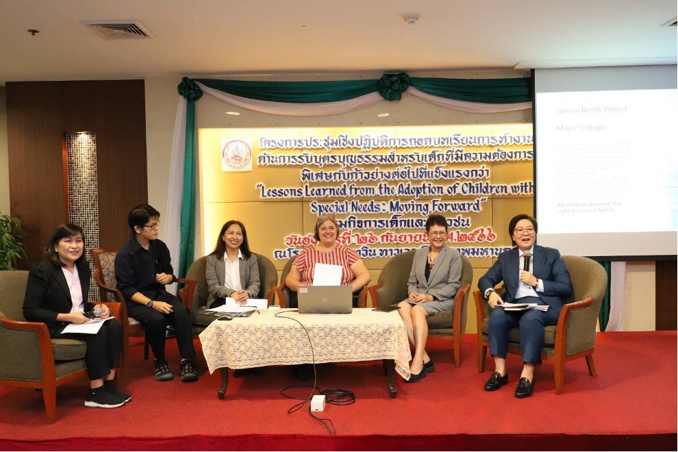 Group of people gather on a stage for conference panel