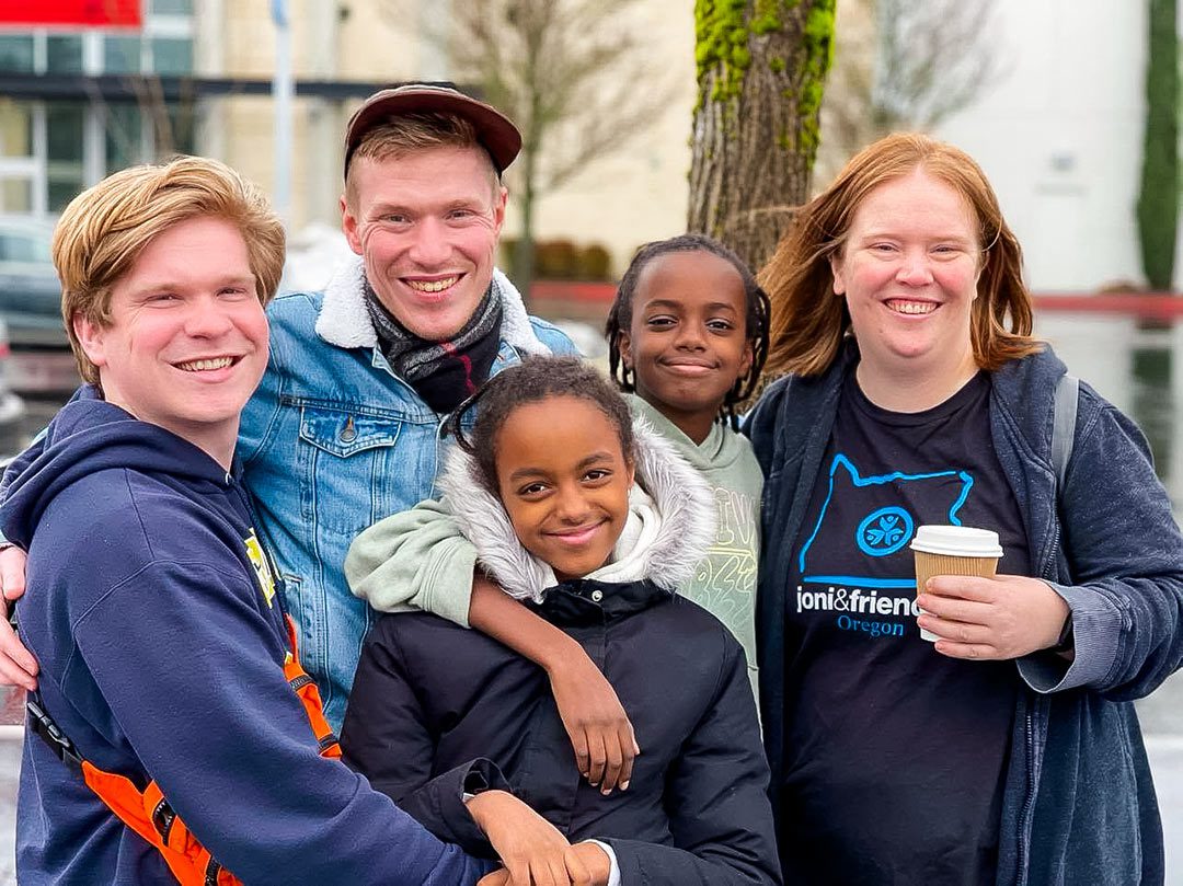 A group of older siblings smile