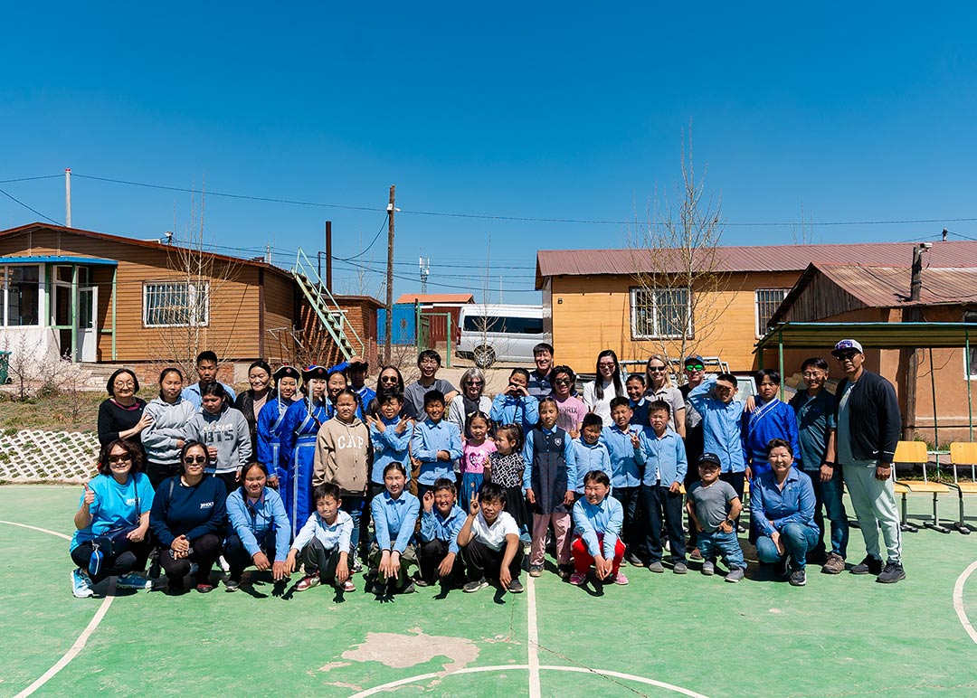 A group photo of children, teachers and Holt donors