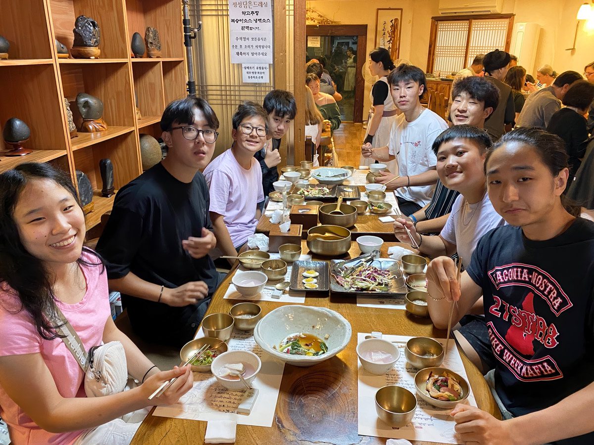 Adoptees on Holt's 2024 Korea Heritage Tour enjoy a meal together.