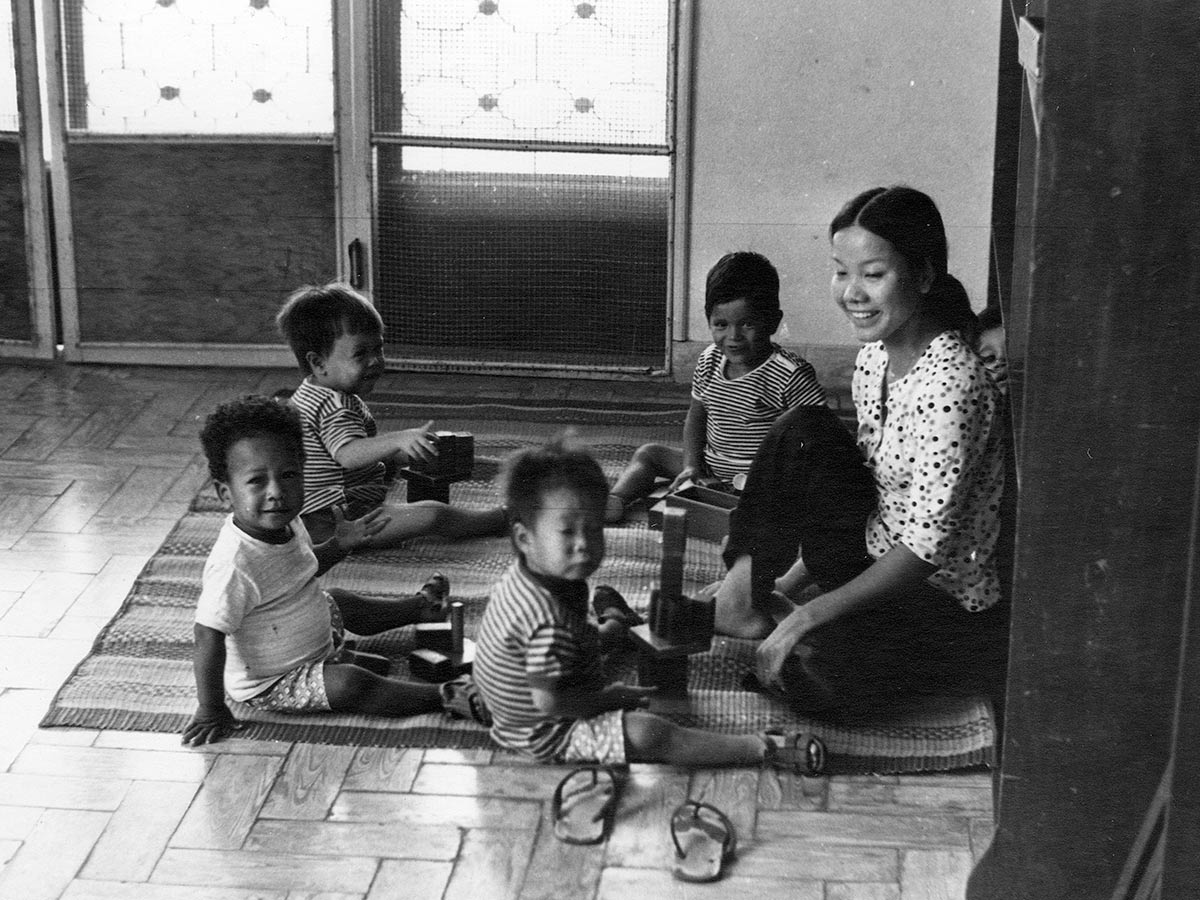 Children in South Vietnam are cared for by a social worker with Holt