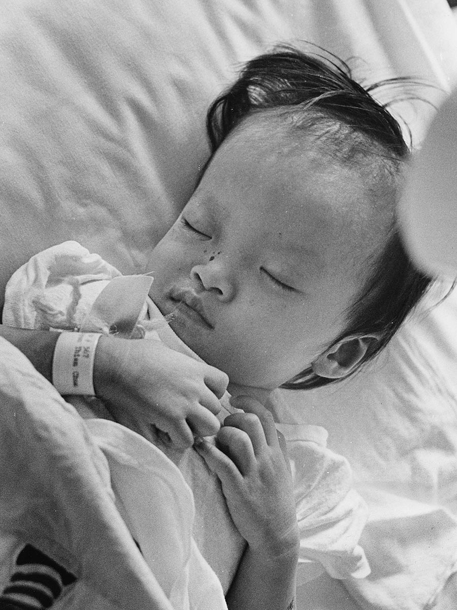 a child wears an identification bracelet in Vietnam for care