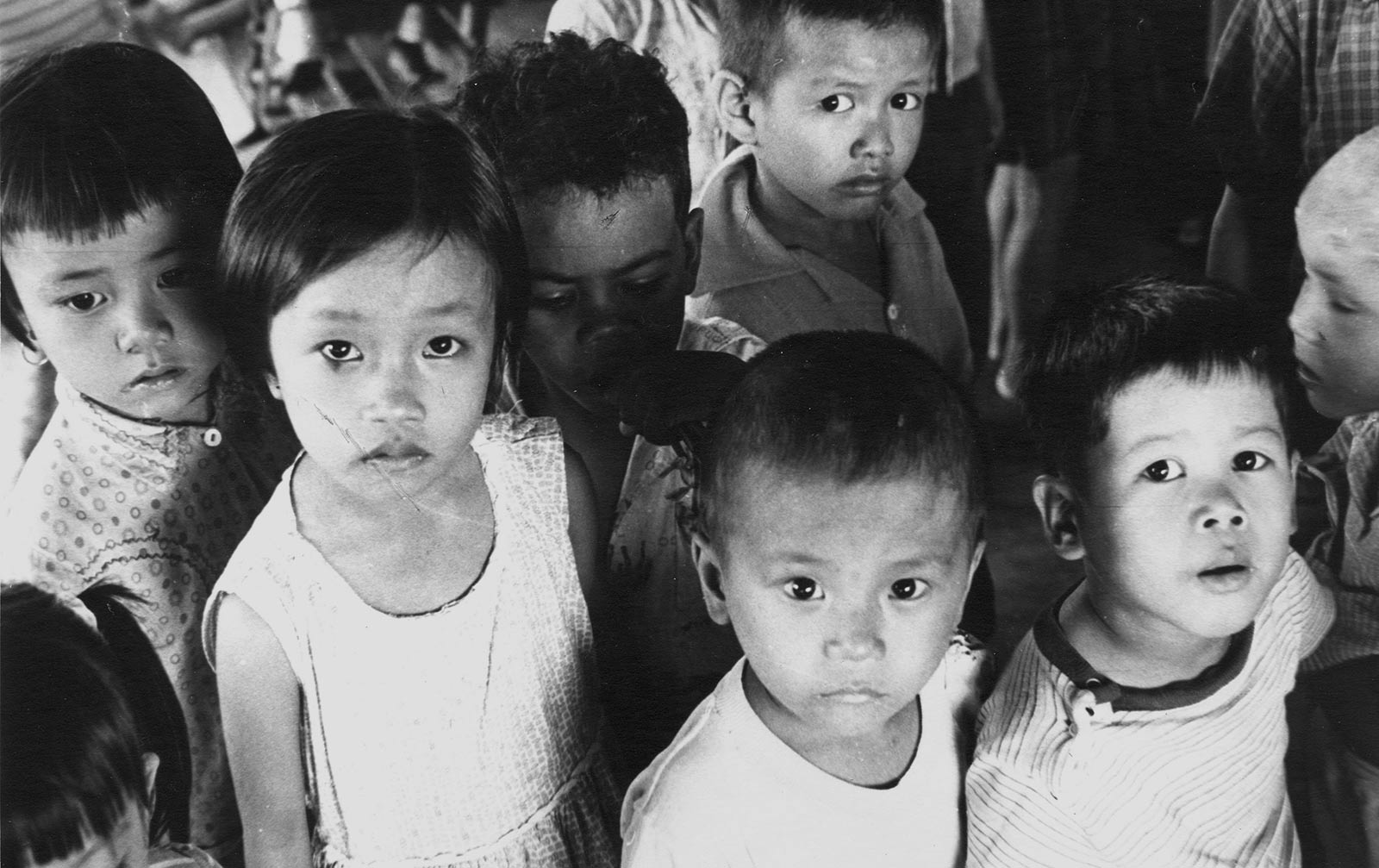 children in need look into the camera in Vietnam, 1975