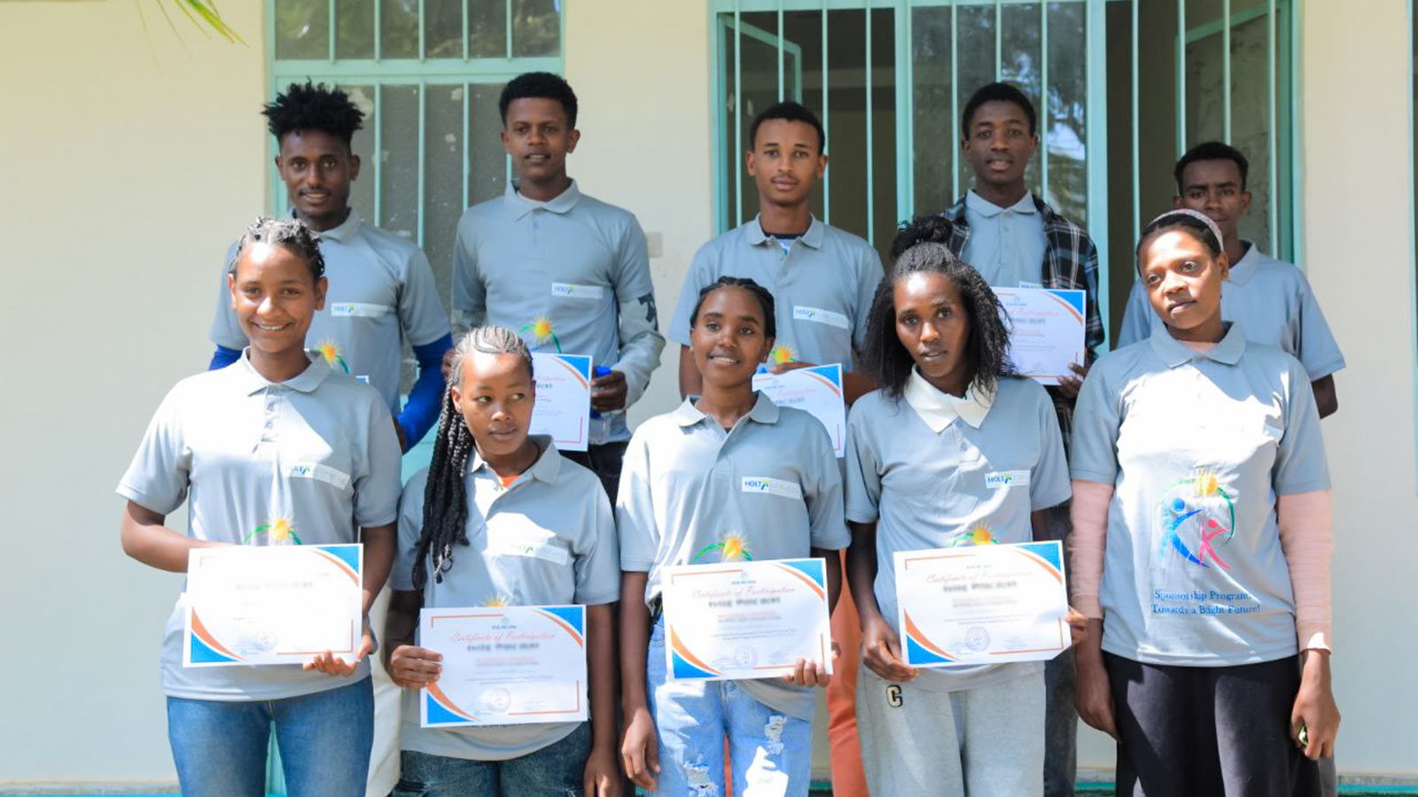 A group of graduates celebrate in Ethiopia because of donor support.