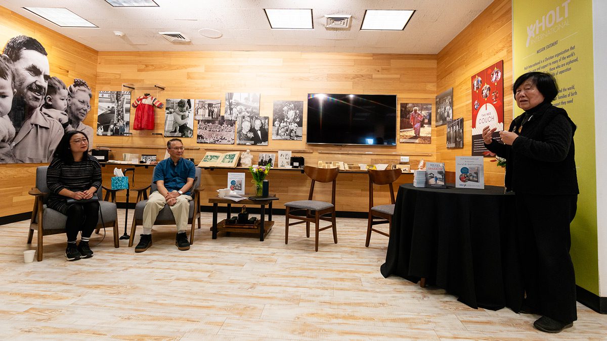 Nancy Kim, wife of David Kim, speaks at an adoptee book event.