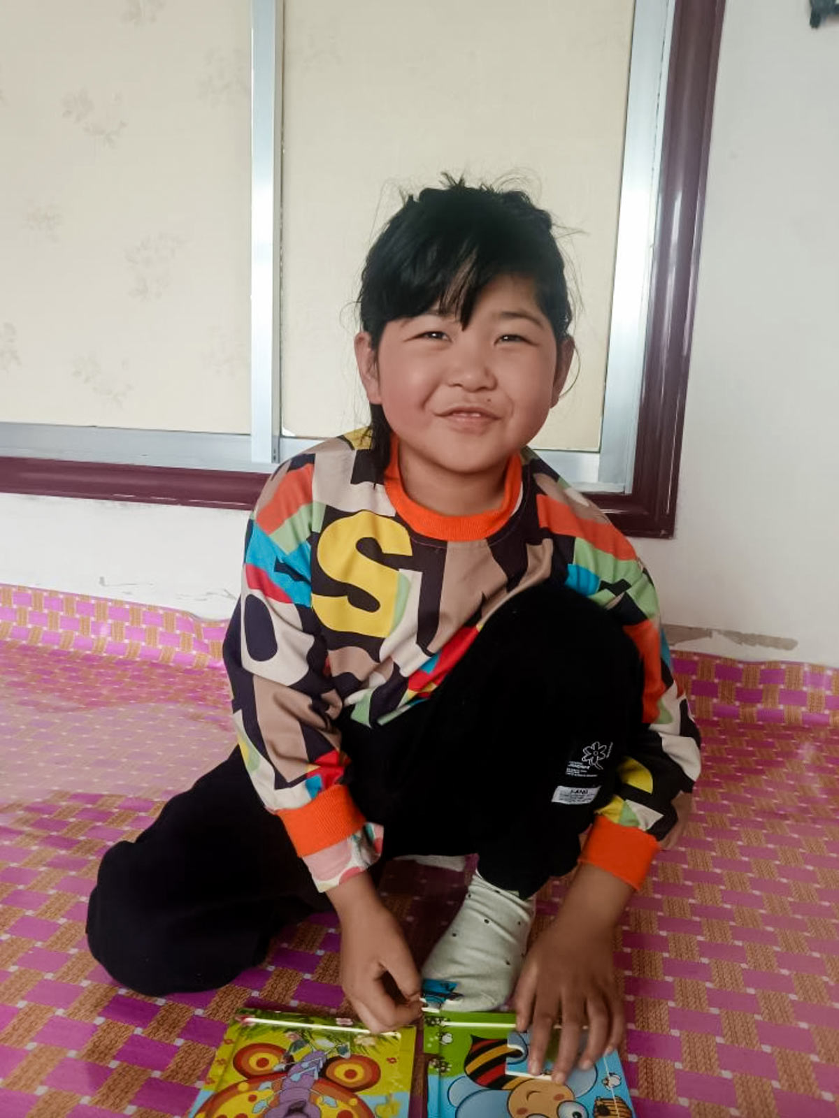 a little girl in china smiles after her heart surgery