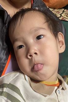 Headshot of sponsored child Chuka at home in Mongolia