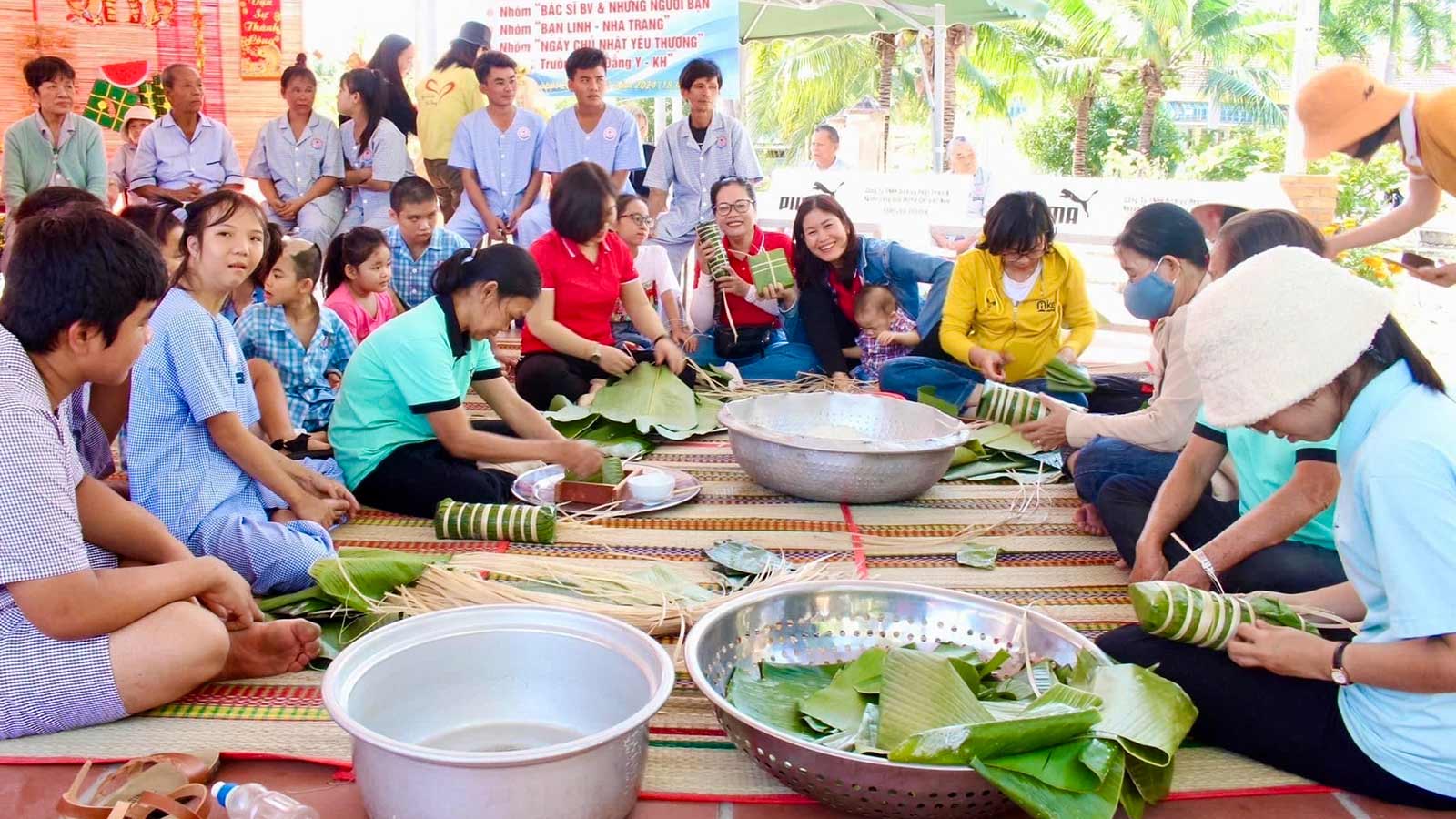 a group of special needs children gather outside for a meal in Vietnam