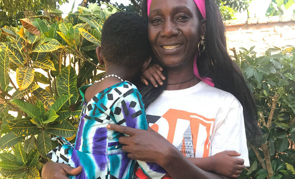 Adoptive mom Grace holds her daughter, Natalie, adopted domestically in Uganda.