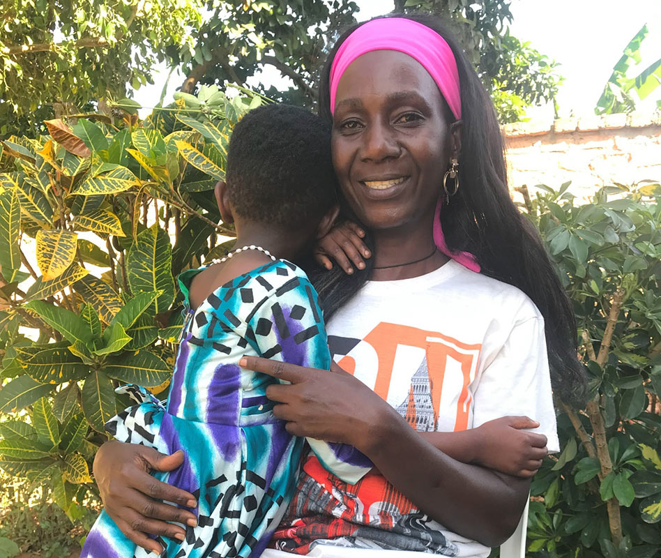 Grace hugs her daughter, Natalie, who she adopted domestically in Uganda with the help of Holt and Home Free.