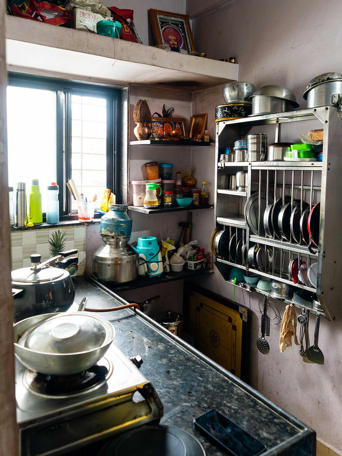 a small, cramped kitchen inside a sponsored child's home