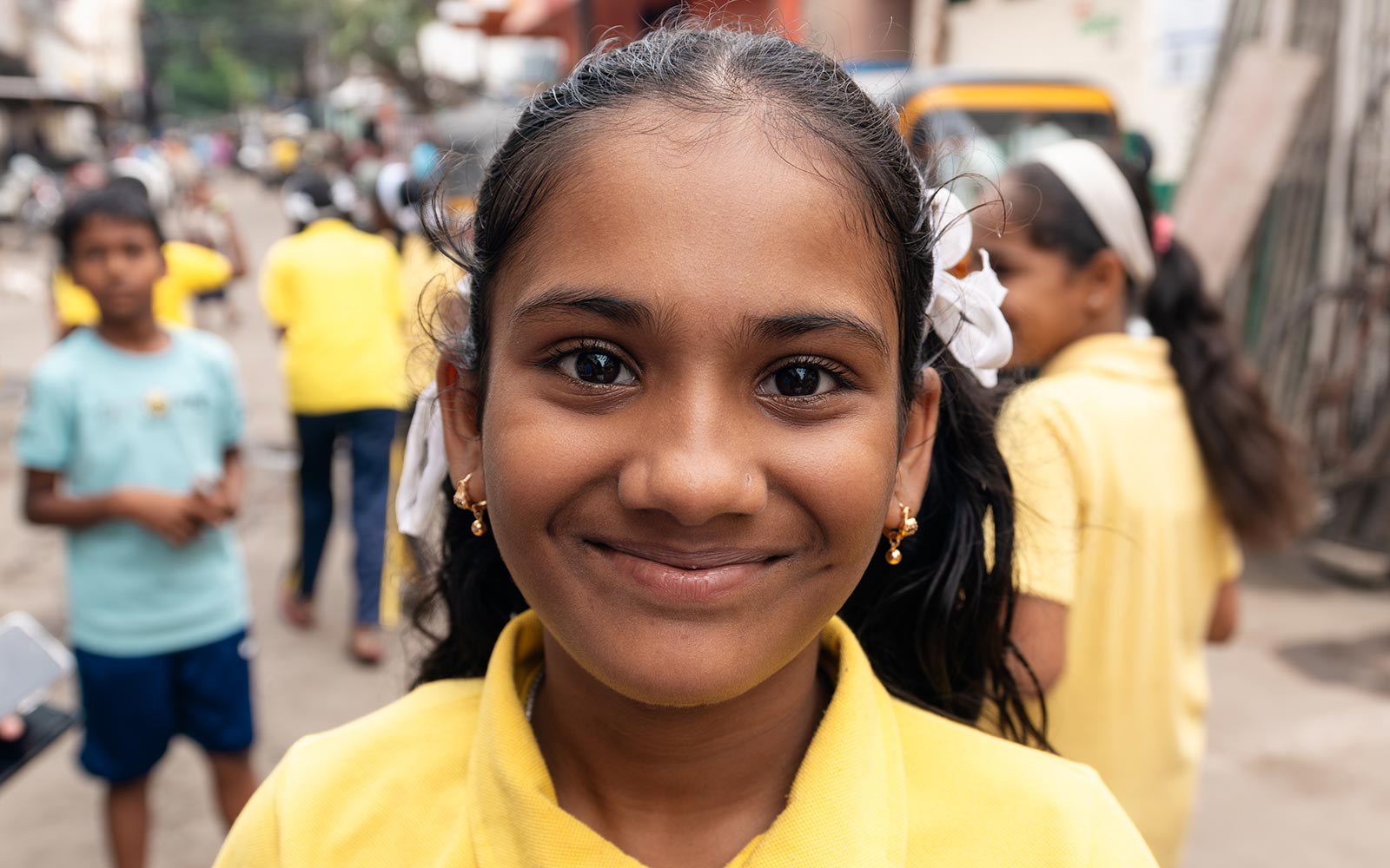 a sponsored girl in India smiles for the camera