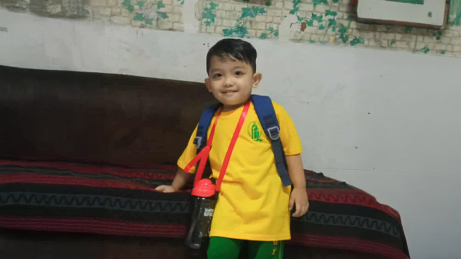 a child in the philippines smiles because donors provided him with school lunch