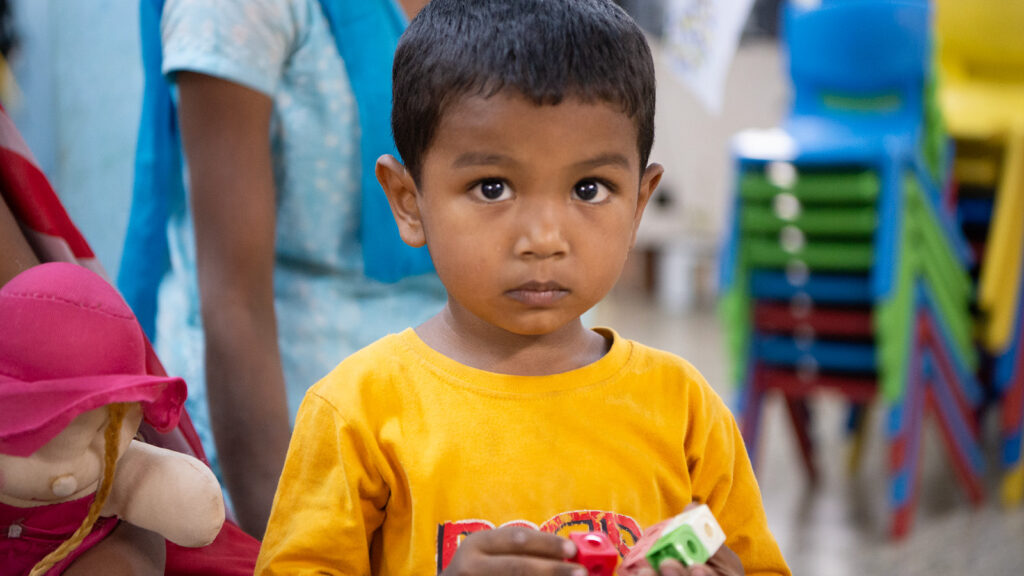 Boy in India looking into the calendar