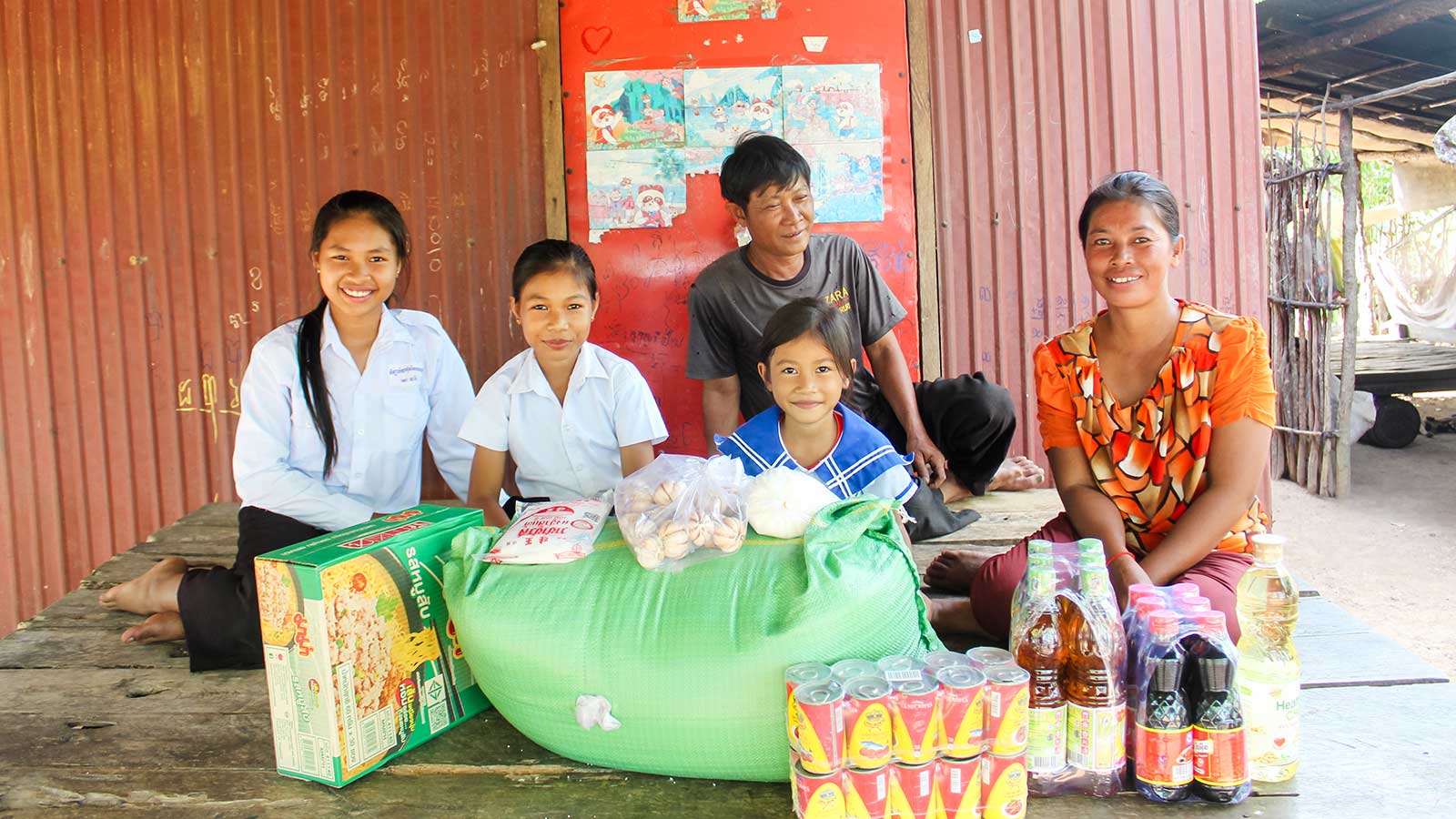 a family in cambodia shares a nutritious meal because of donors feeding hungry families