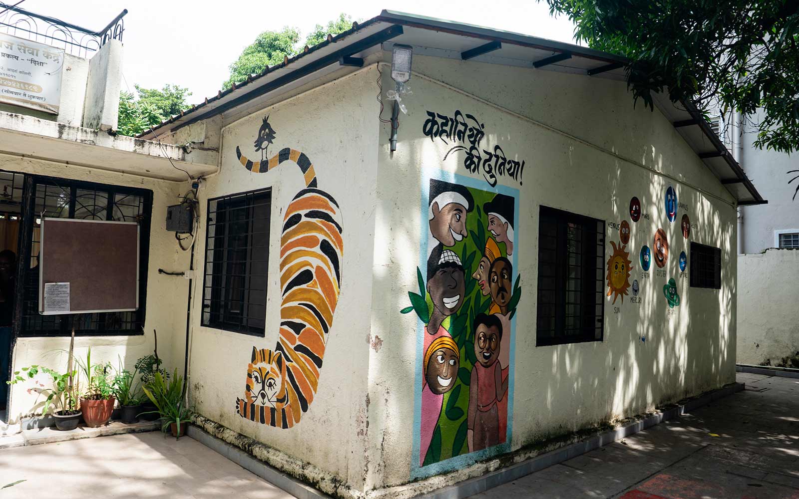 a drop-in center with painted murals of a tiger and children in India
