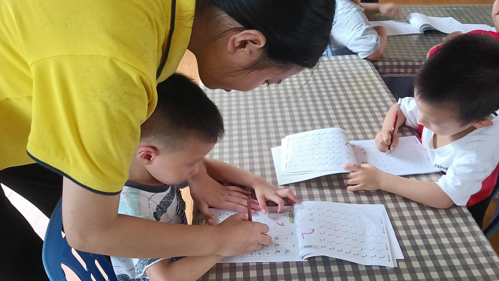a young woman in the Technical School Student Program helps at a daycare for her internship