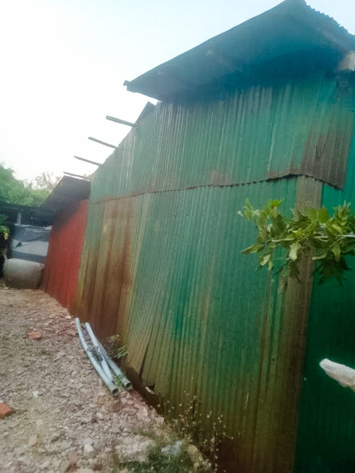 One family's home — a dilapidated and rusty shed in Cambodia