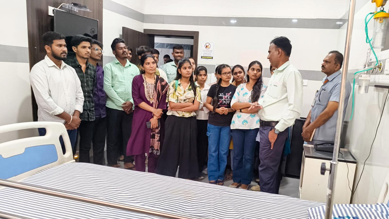 a group of young people tour a hospital in india for career day