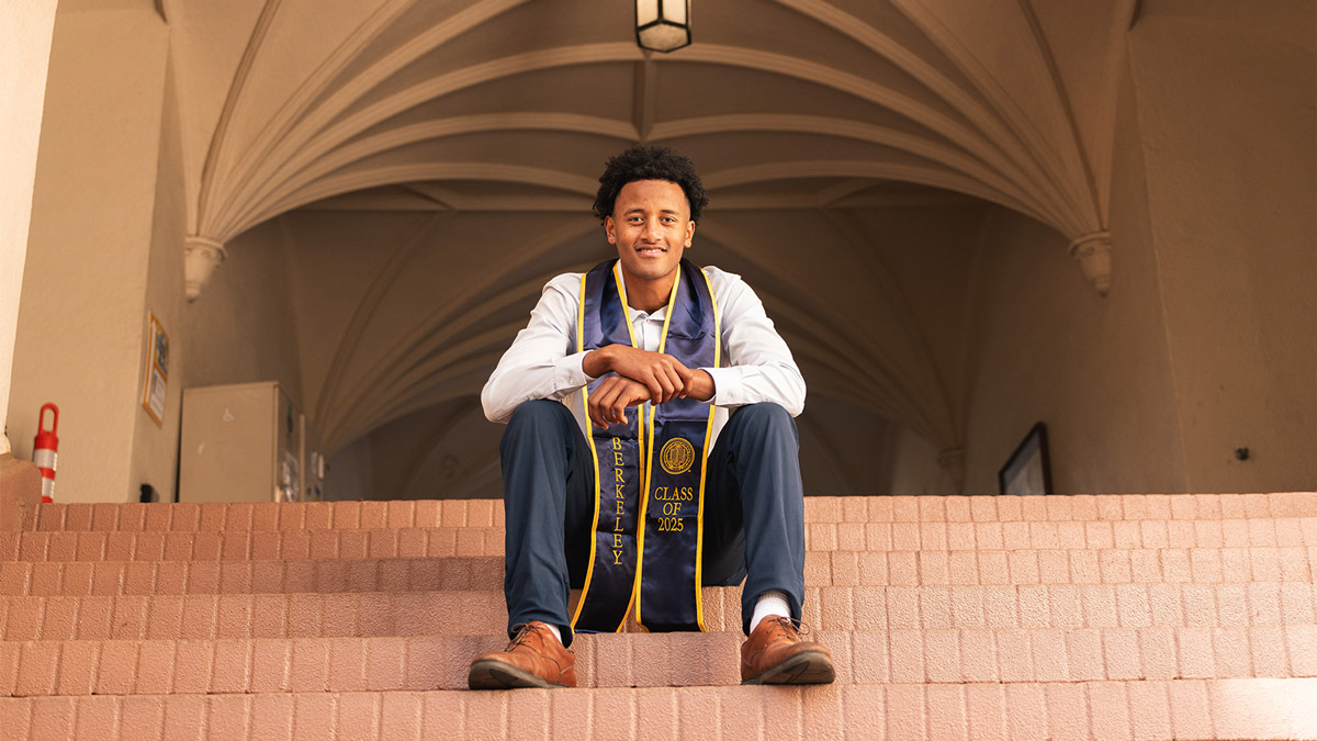 Holt adoptee Belay Brummel sits on UC Berkeley campus for graduation photo