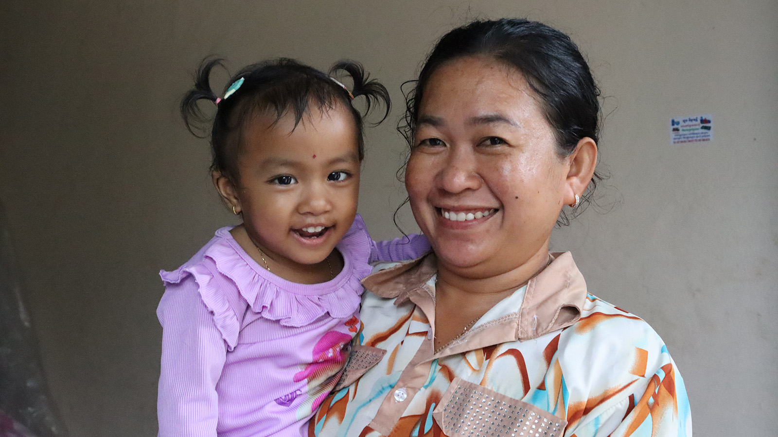 A 3-year-old girl in Holt foster care with her foster mother in Cambodia.