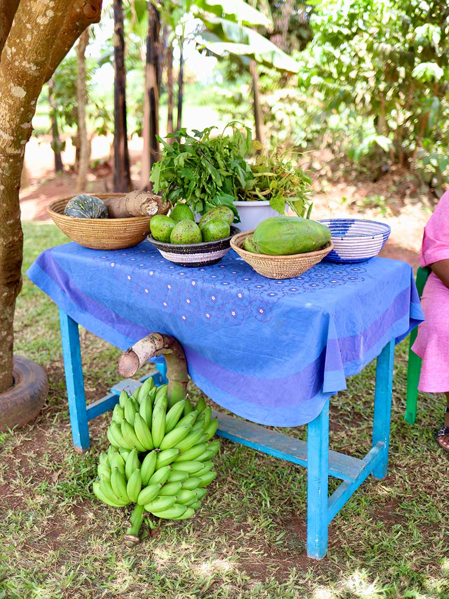 a table full of fruits and vegetables in rural Uganda